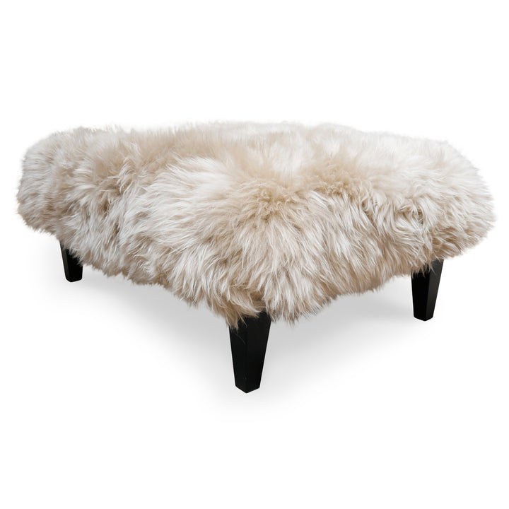 Side View of Sheepskin Footstool Coffee Table with solid hardwood legs