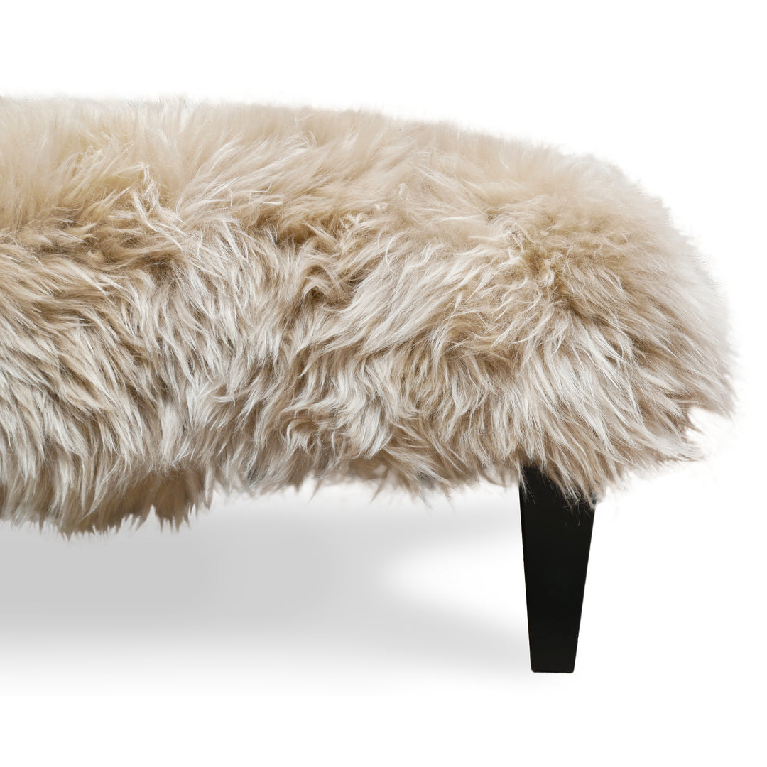 detailed view of Sheepskin Footstool Coffee Table with solid hardwood legs